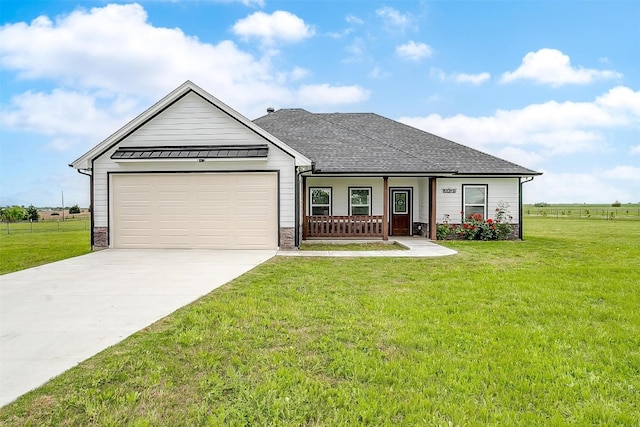 view of front of house featuring a garage and a front yard