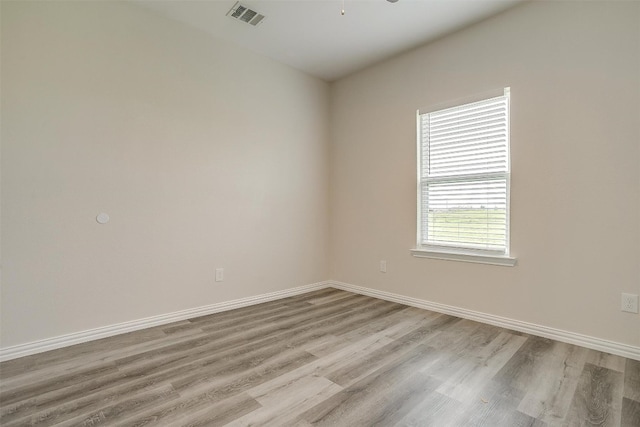 empty room with wood-type flooring