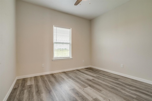 spare room featuring ceiling fan and hardwood / wood-style floors