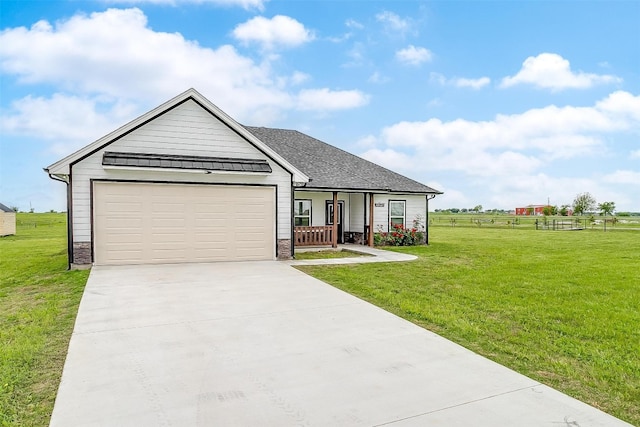 view of front facade with a garage and a front lawn