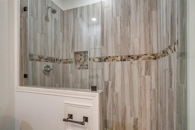 bathroom with a tile shower