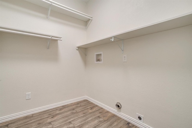 washroom featuring wood-type flooring, washer hookup, and electric dryer hookup