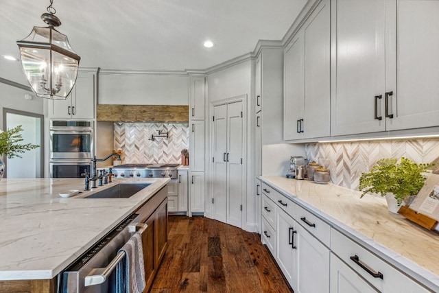 kitchen featuring dark hardwood / wood-style flooring, tasteful backsplash, stainless steel appliances, and light stone countertops