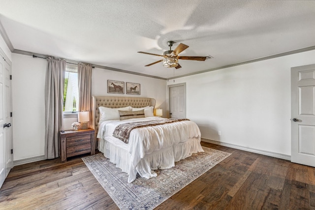 bedroom with wood-type flooring, a textured ceiling, ceiling fan, and crown molding