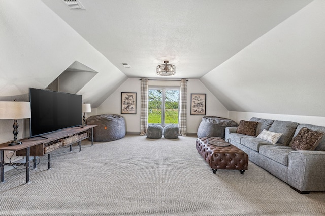 carpeted living room featuring vaulted ceiling