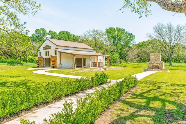 view of yard with an outdoor stone fireplace