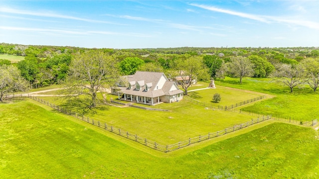 birds eye view of property with a rural view