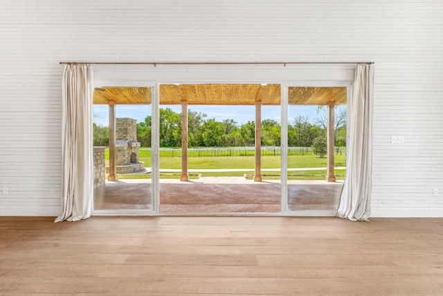 doorway to outside with light wood-type flooring