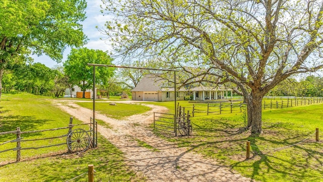 view of nearby features with a rural view and a yard