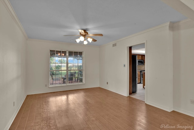 empty room with light wood-type flooring, ceiling fan, and crown molding