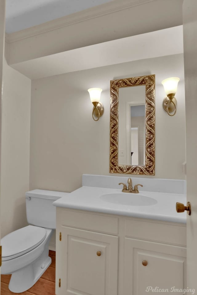 bathroom featuring vanity, toilet, and tile patterned floors