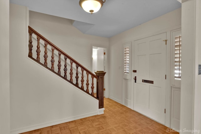 entryway with light parquet floors