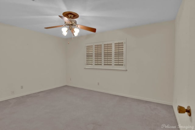 unfurnished room with light colored carpet and ceiling fan