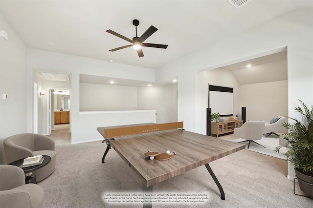 game room featuring ceiling fan, light colored carpet, and vaulted ceiling