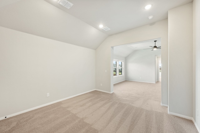 bonus room featuring vaulted ceiling, light colored carpet, and ceiling fan