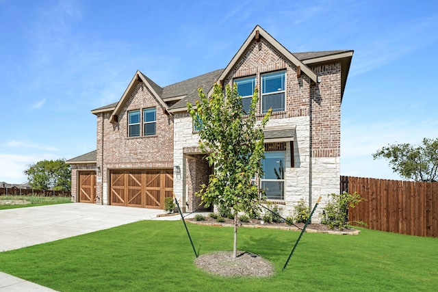 craftsman inspired home with a front yard and a garage