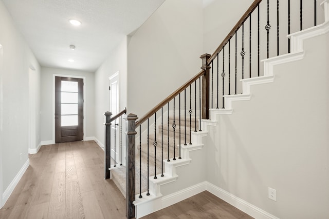 entryway with light hardwood / wood-style floors