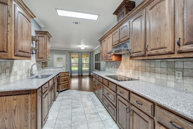 kitchen featuring black electric cooktop, light tile patterned floors, decorative backsplash, sink, and ornamental molding