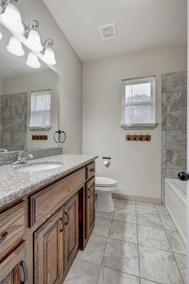 bathroom with tile patterned floors, toilet, and vanity