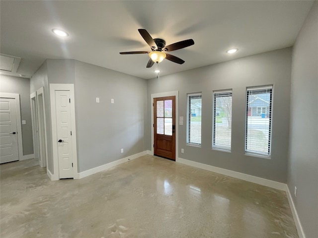 foyer entrance with ceiling fan