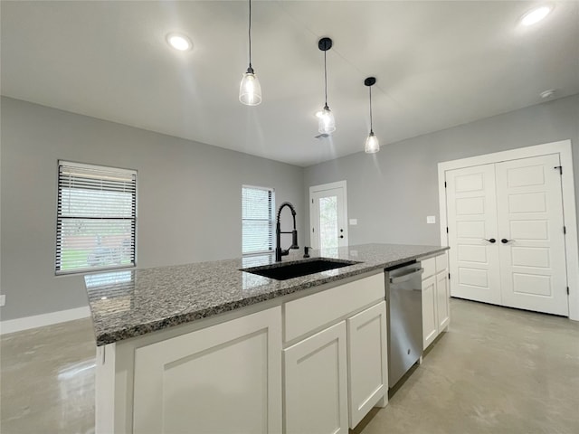 kitchen featuring pendant lighting, white cabinets, sink, dishwasher, and stone countertops