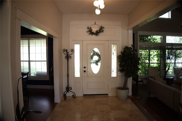 foyer entrance featuring a wealth of natural light and tile flooring