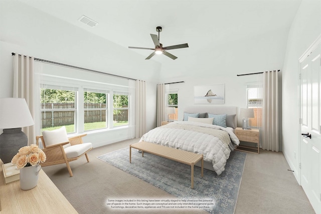 carpeted bedroom with vaulted ceiling and ceiling fan