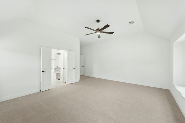 interior space with light carpet, vaulted ceiling, and ceiling fan