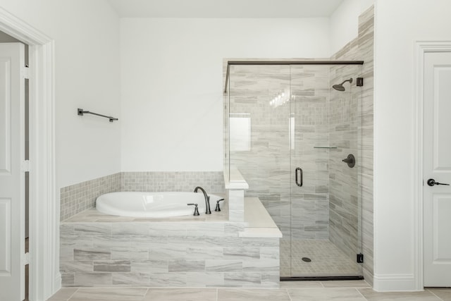 bathroom featuring plus walk in shower and tile patterned floors