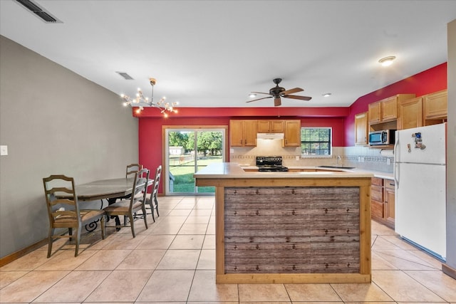 kitchen with white fridge, black electric range, tasteful backsplash, and light tile flooring