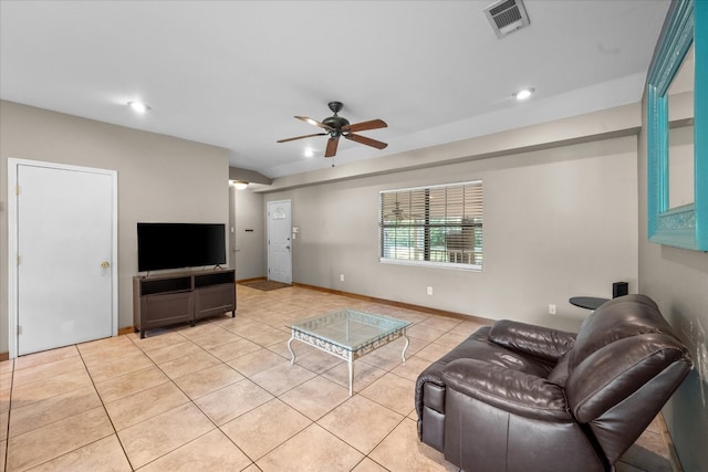 living room with ceiling fan and light tile floors