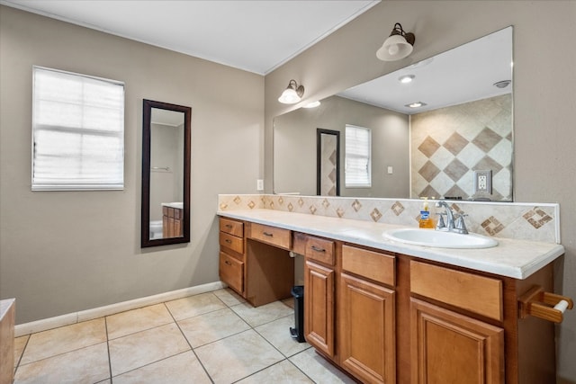 bathroom with tile flooring, vanity with extensive cabinet space, and tasteful backsplash