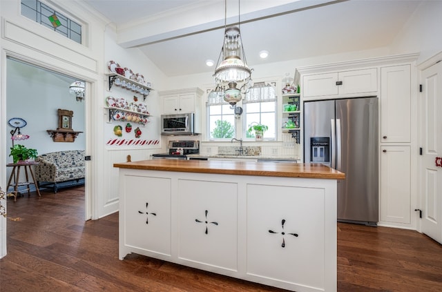 kitchen featuring white cabinets, wood counters, dark hardwood / wood-style floors, backsplash, and stainless steel appliances