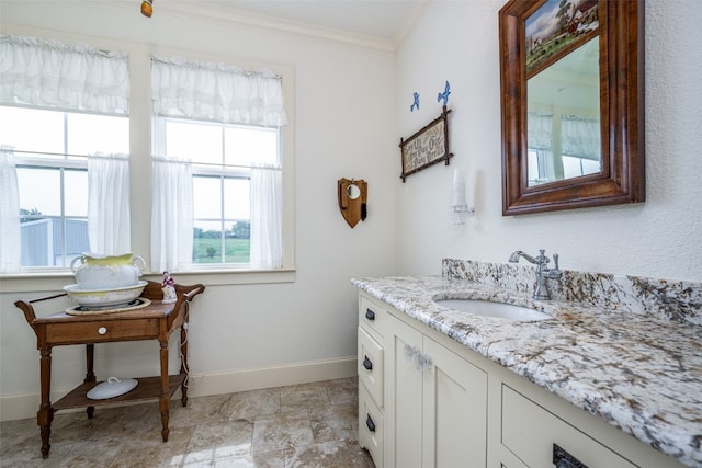 bathroom featuring crown molding, tile floors, and vanity