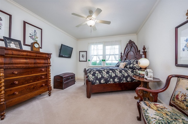 bedroom with carpet flooring, crown molding, and ceiling fan