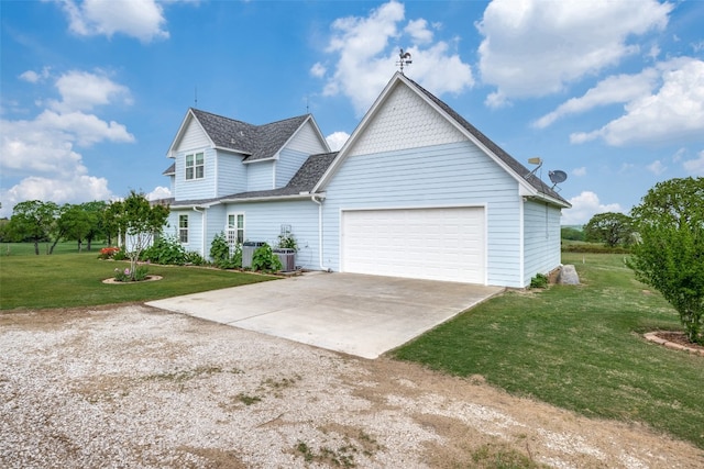 view of front facade with a garage and a front lawn