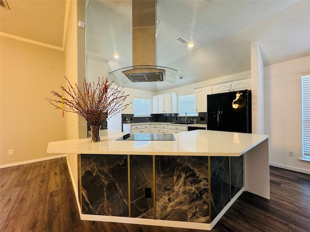 kitchen featuring kitchen peninsula, black appliances, dark hardwood / wood-style floors, white cabinets, and island exhaust hood