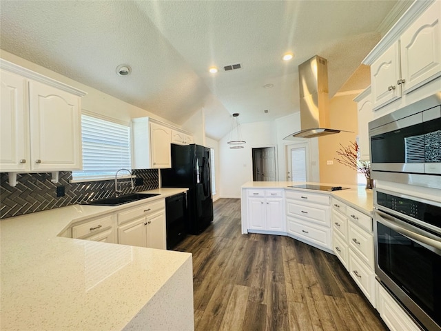 kitchen with decorative light fixtures, black appliances, tasteful backsplash, dark wood-type flooring, and extractor fan