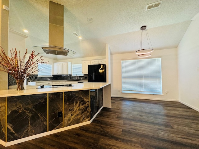 kitchen featuring white cabinets, black fridge with ice dispenser, island range hood, and dark wood-type flooring