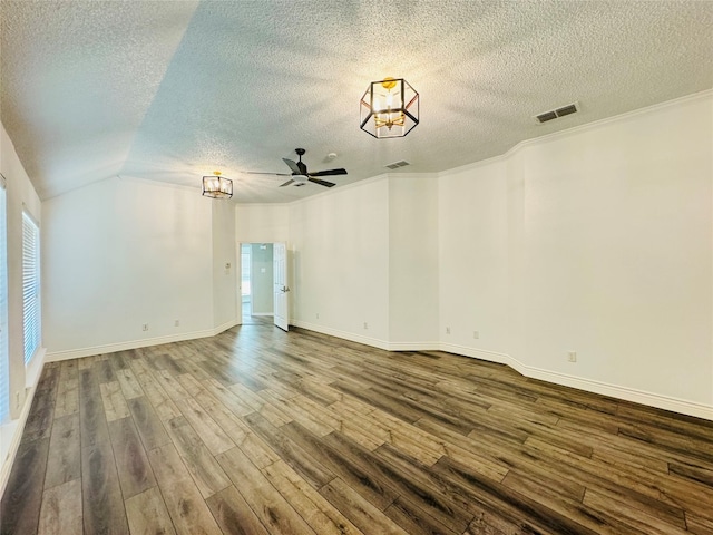 unfurnished room featuring ornamental molding, wood-type flooring, vaulted ceiling, and a textured ceiling