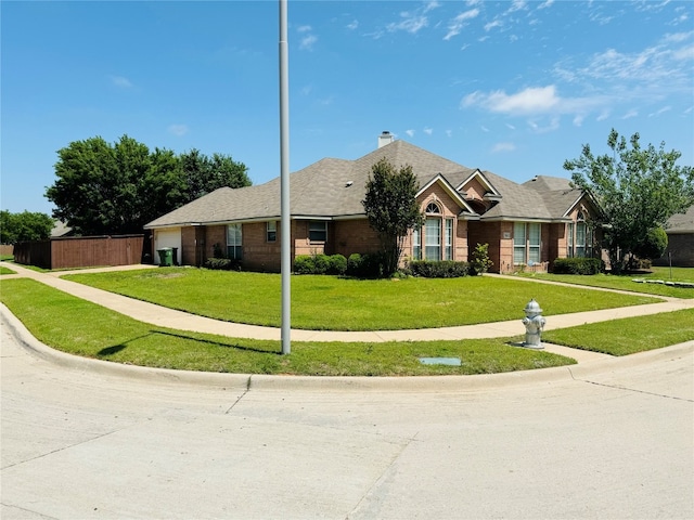 single story home with a front lawn