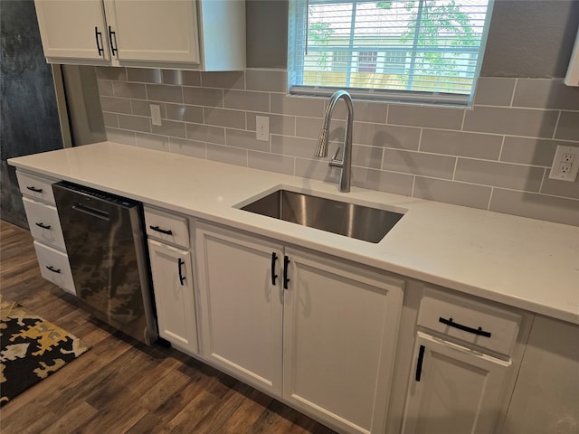 kitchen featuring backsplash, dishwasher, white cabinetry, sink, and dark hardwood / wood-style flooring