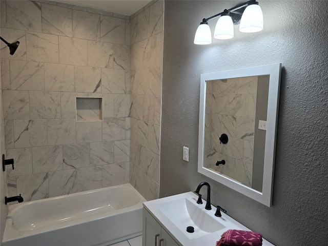 bathroom featuring tiled shower / bath combo and large vanity