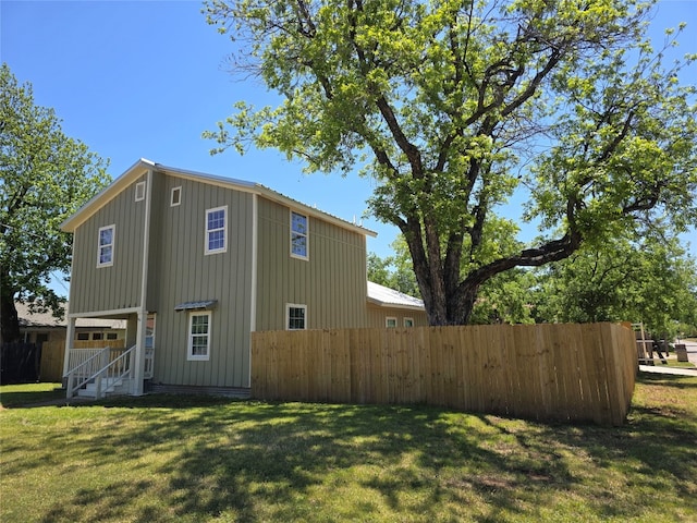 view of home's exterior featuring a lawn