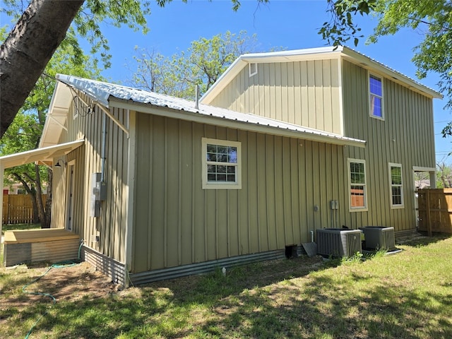 view of property exterior with a yard