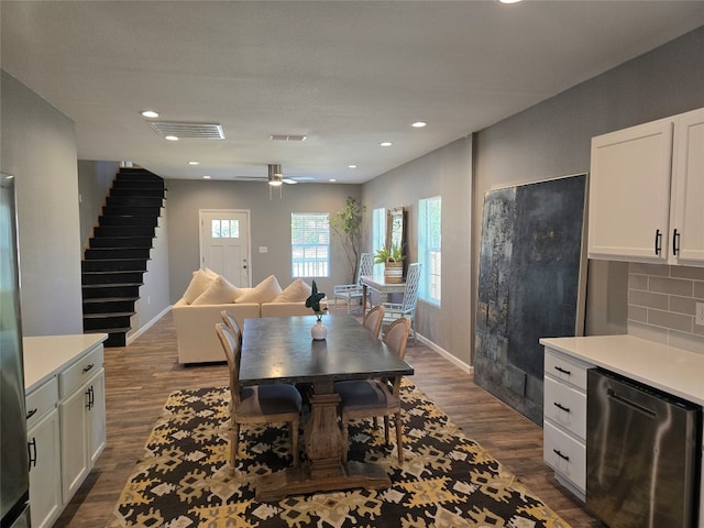 dining room featuring dark hardwood / wood-style flooring and ceiling fan