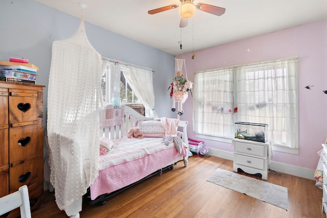 bedroom featuring ceiling fan and light wood-type flooring