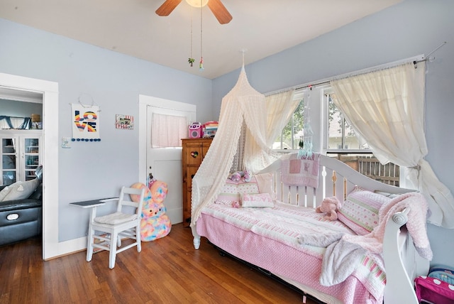 bedroom featuring wood-type flooring and ceiling fan