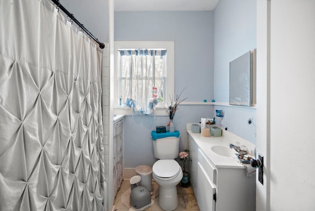 bathroom featuring toilet, tile floors, and vanity