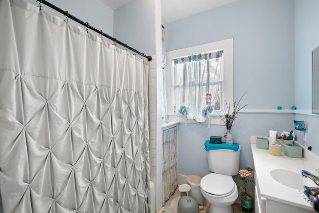 bathroom with vanity and toilet